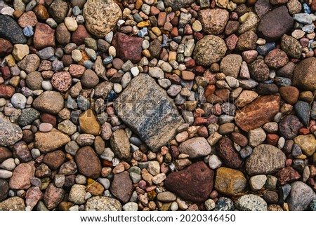 Fieldstones as a natural background for further graphic works.
