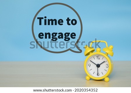 Yellow clock on blue background with text TIME TO ENGAGE