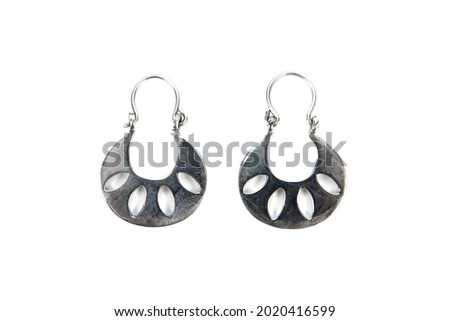 Silver earrings horseshoe design pattern isolated on white background. 