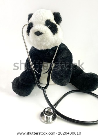 quotes concept - stay safe with the panda and stethoscope white isolated