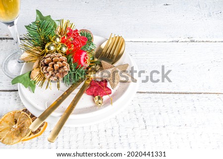  Christmas or New Year table setting. Place setting for Christmas Dinner with Xmas Holiday Decorations