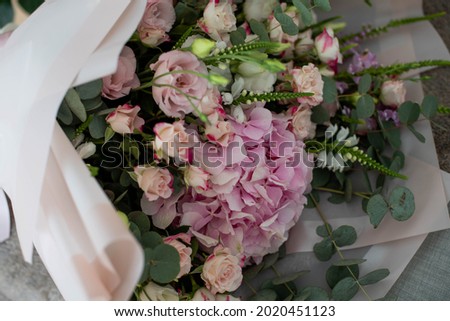 bouquets of mixed flowers the work of the florist at a flower shop. Delicate Pastel color. Fresh cut flower. Green and pink color