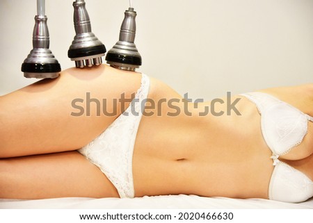 Rf skin tightening. Hardware cosmetology. Ultrasound cavitation body contouring treatment, anti-cellulite and anti-fat therapy in beauty salon. Large collage with different parts of the body Royalty-Free Stock Photo #2020466630