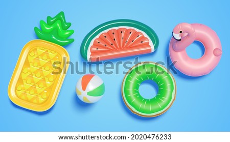 3d swim collection of pool floats, including a beach ball, fruit shape lilo beds, and swimming rings. Summer party elements viewed from above, isolated on blue background. Royalty-Free Stock Photo #2020476233