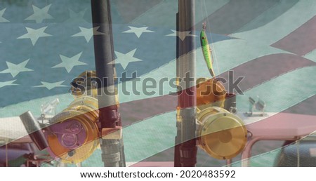 American flag waving against close up view of two fishing rod on a boat. american independence and celebration concept