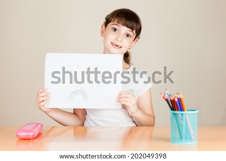 Girl holding picture 