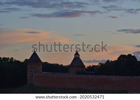 Kremlin. Evening view of the Palace and Spasskaya towers against the background of sunset sunset . Veliky Novgorod. Russia. 