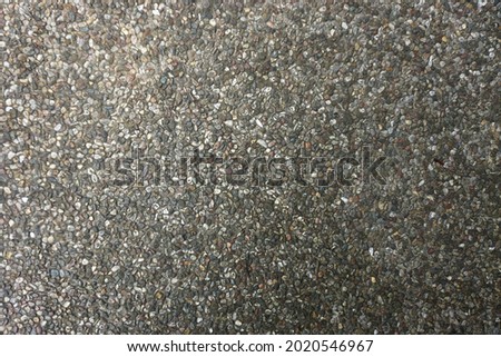 Tiny pebbles rough texture horizontal background pattern