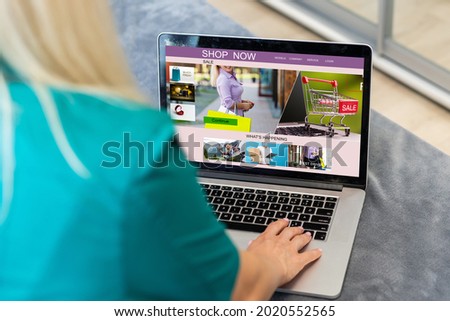 Young woman using laptop computer. Online shopping concept