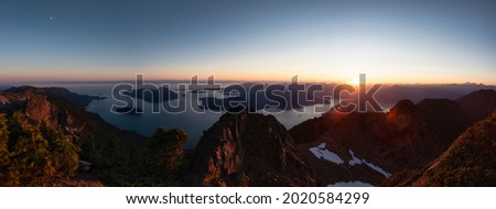 Panoramic View of Rocky Canadian Mountain Landscape. Sunny Summer Sunset. Aerial Scene from Mnt Brunswick, near Vancouver and Squamish, British Columbia, Canada.
