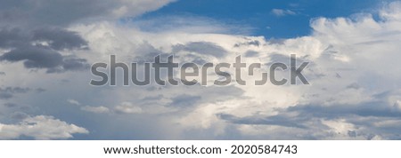 The blue sky is covered with various light and dark clouds, the sky after the rain