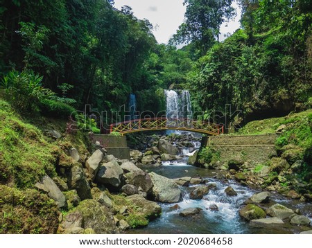 jenggala waterfall located in banyumas area of central Java Royalty-Free Stock Photo #2020684658