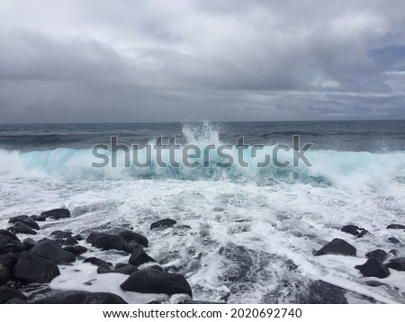Photo crushing bright turquoise waves on black rocks beach in Hawaii big island. Virtual background photo. Digital cover for book, instagram post, linkedin post, facebook banner, discord space, ocean