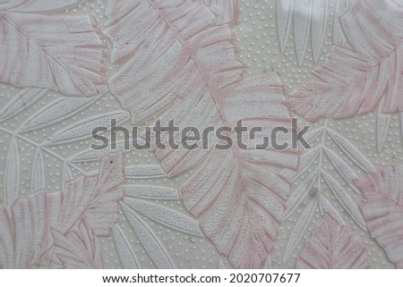 ceramic floor tile with leaf pattern. 