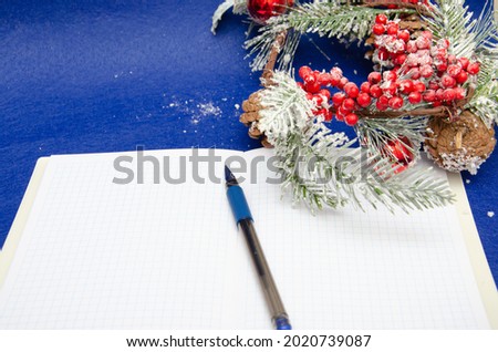 Christmas decoration on blue background. Concept letter for Santa Claus, top view and space for text