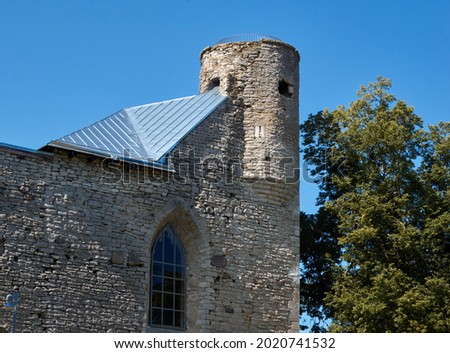 Old fortress tower against blue sky. High quality photo Royalty-Free Stock Photo #2020741532