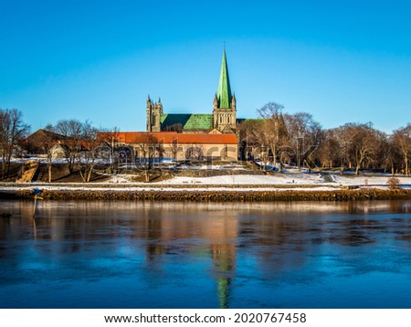 A beautiful view of the lake and the Nidaros Cathedral Trondheim Norway