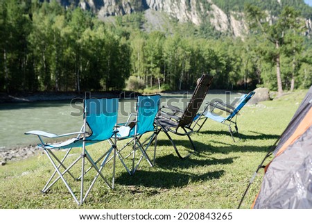 Camping chair in the beach of river