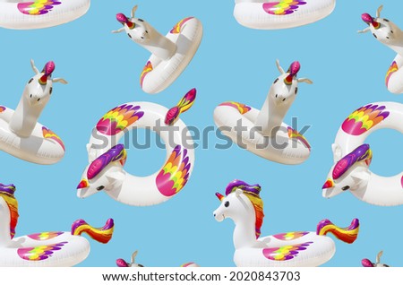 inflatable circle or ring for kids rainbow unicorn for floating in summer vacation isolated on blue background, inflatable toy pattern