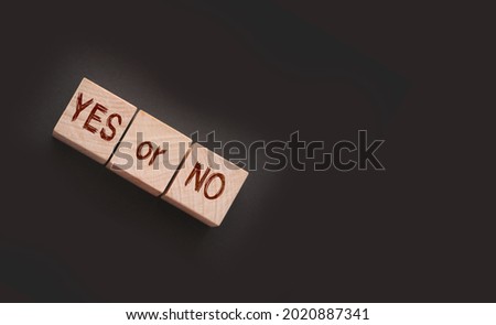 Words YES or NO on wooden blocks. Business and career, education choice concept.
