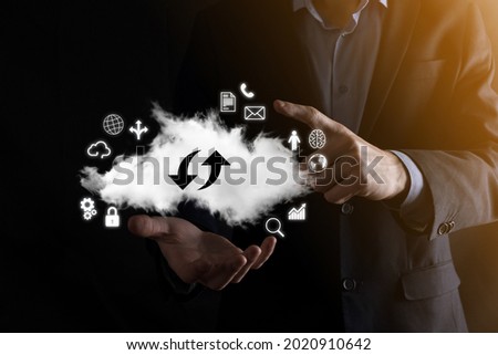 Cloud technology. cloud storage sign with two arrows up and down on dark . Cloud computing, big data center, future infrastructure, digital ai concept. Virtual hosting symbol.