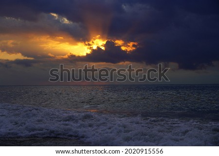 waves at sea during sunset