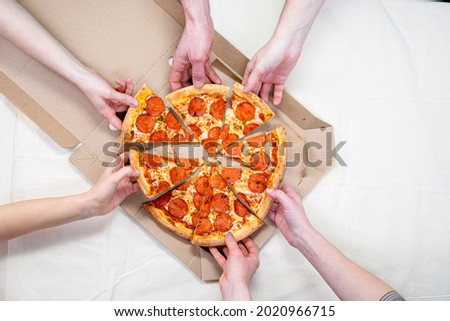 Holding Pizza on White Box