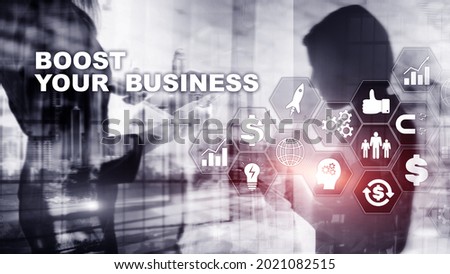 Financial and Technology concept. On a virtual screen inscription: Boost Your Business.