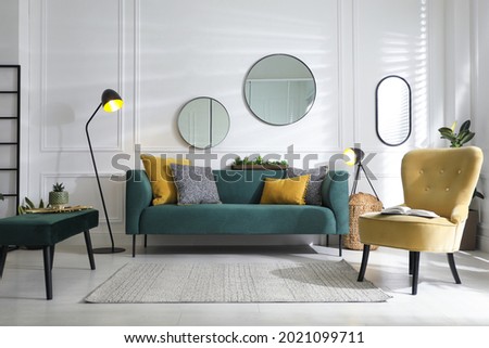 Modern living room interior with stylish comfortable sofa Royalty-Free Stock Photo #2021099711