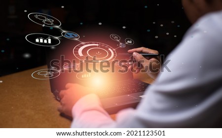 A male office worker in a white shirt looks at work in the world of AI technology and research. Several icons accompany a photograph of coffee lights in the upper left corner.