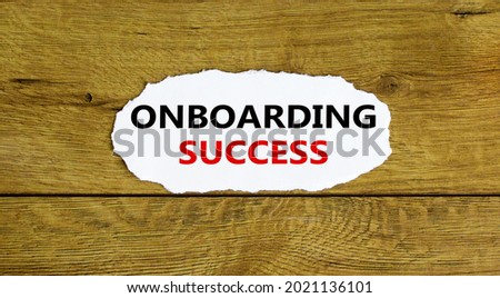 Onboarding success symbol. Words 'Onboarding success' on white paper. Beautiful wooden background. Business, onboarding success concept. Copy space.