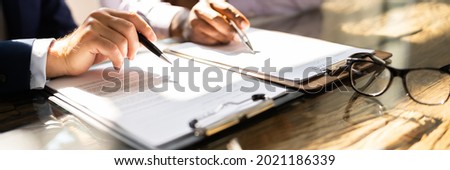 Business Document Contract Review. Lawyer In Suit