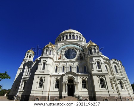 Bottom view of the St. Nicholas Cathedral on the background of a cloudless sky, on a summer day in Kronstadt.