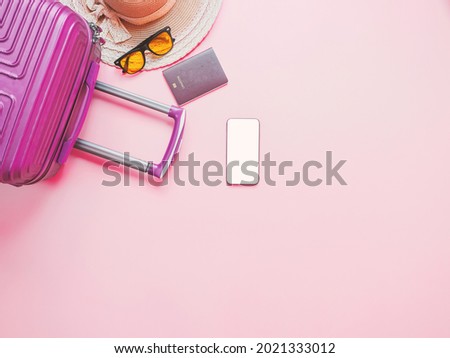 Summer traveler accessories on pink background, Smartphone with blank screen.