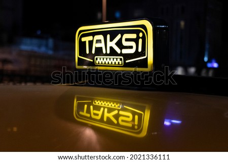 Close-up of Istanbul taxi at night. The word "taksi" translated from Turkish means "taxi".