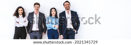 The business people standing on the white wall background Royalty-Free Stock Photo #2021345729