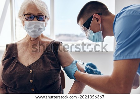 elderly woman in hospital immunization safety health care