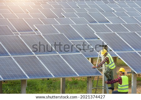 solar power station,Solar panels with technician,Future electrical production, asian engineers