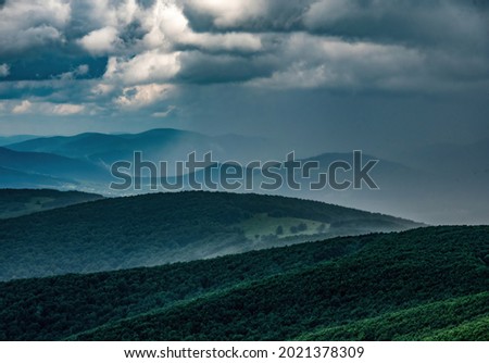 A beautiful view of the Polish Bieszczady Mountains. Changeable weather in the mountains. A few minutes before the storm. Picture taken from the big Rawka.
