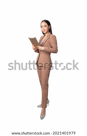 Smiling asian business woman looking at the camera over white background. Wearing brown suit.