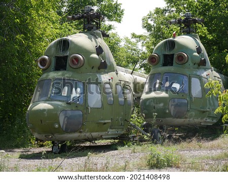 Old military abandoned helicopter. Broken non-working helicopter green.