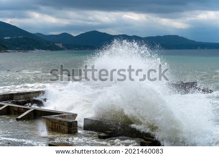 small storm on the sea, waves hitting the shore