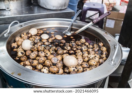 Famous Taiwanese street food -  braised quail eggs in master stock