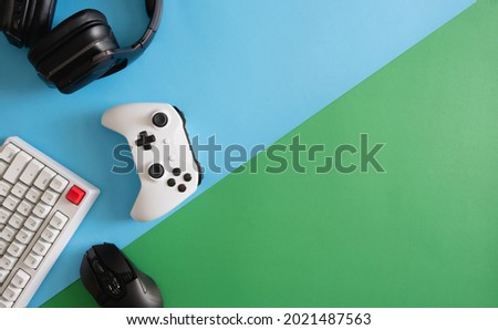 gamer work space concept, top view a gaming gear, mouse, keyboard, joystick, headset.