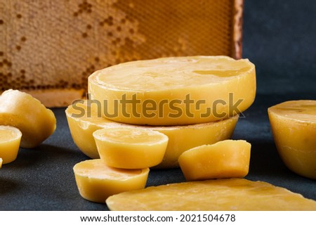 Blocks of beeswax for candle making. Raw beeswax. Handmade candle production. Royalty-Free Stock Photo #2021504678