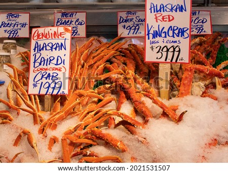 Alaskan Snow Crab and Red Grab claws on ice and for sale in market