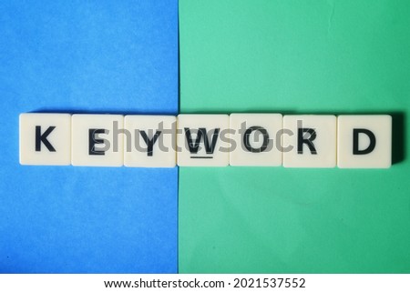 An image of arrangement of Keyword wording over blue and green background