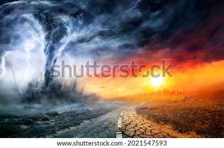Tornado In Stormy Landscape - Climate Change And Natural Disaster Concept Royalty-Free Stock Photo #2021547593