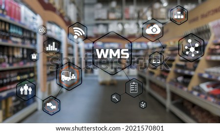 Inscription WMS on blurred warehouse background. Werehouse Management System Royalty-Free Stock Photo #2021570801