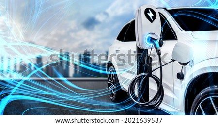 EV charging station for electric car in concept of green energy and eco power produced from sustainable source to supply to charger station in order to reduce CO2 emission . Royalty-Free Stock Photo #2021639537